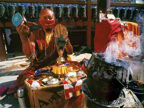 
Monk Reciting Mantras At Boudhanath Kathmandu Nepal - Buddhism: Eight Steps To Happiness by Dieter Glogowski book

